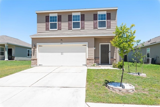 204 Peony Ln, Jarrell, TX 76537 - view of front of property with an attached garage, brick siding, a front yard, and concrete driveway