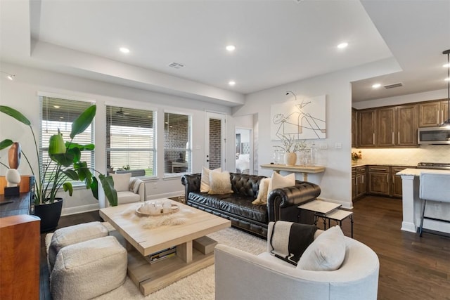 5333 Corelli Fls, Round Rock, TX 78665 - living area with recessed lighting, dark wood-style floors, and baseboards