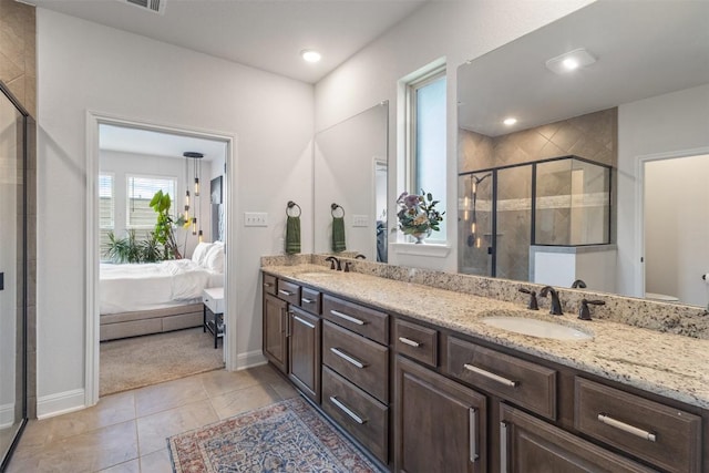 5333 Corelli Fls, Round Rock, TX 78665 - bathroom featuring double vanity, a stall shower, connected bathroom, baseboards, and recessed lighting