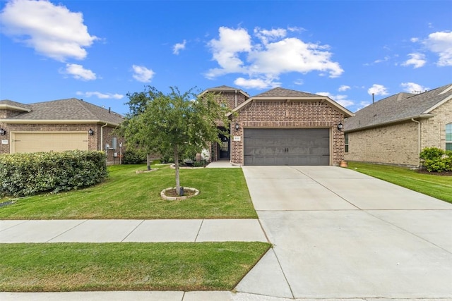 5333 Corelli Fls, Round Rock, TX 78665 - view of front of home featuring brick siding, a garage, a front yard, and driveway
