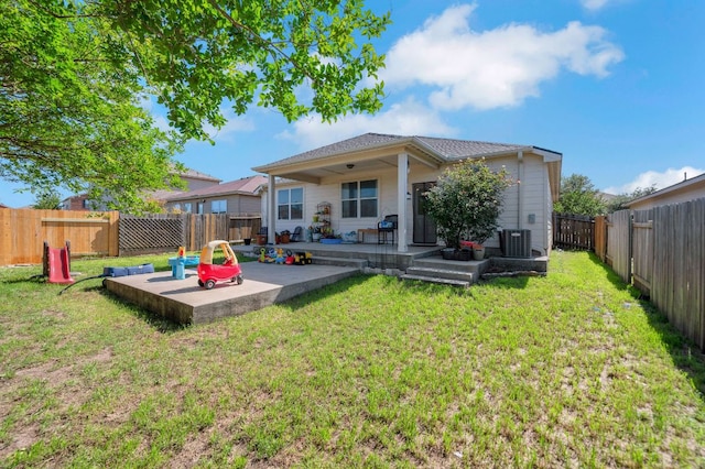 213 Sapphire Ln, Jarrell, TX 76537 - rear view of house with central AC and a patio