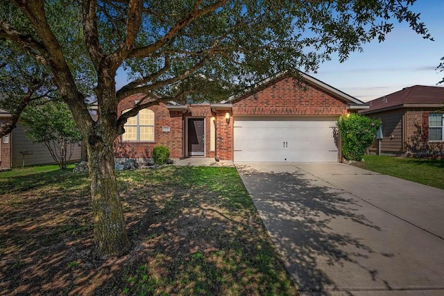 213 Sapphire Ln, Jarrell, TX 76537 - ranch-style home with an attached garage, driveway, and brick siding