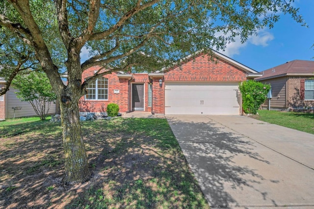 213 Sapphire Ln, Jarrell, TX 76537 - single story home with brick siding, a garage, and driveway