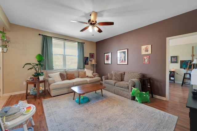 213 Sapphire Ln, Jarrell, TX 76537 - living room with a ceiling fan, wood finished floors, and baseboards