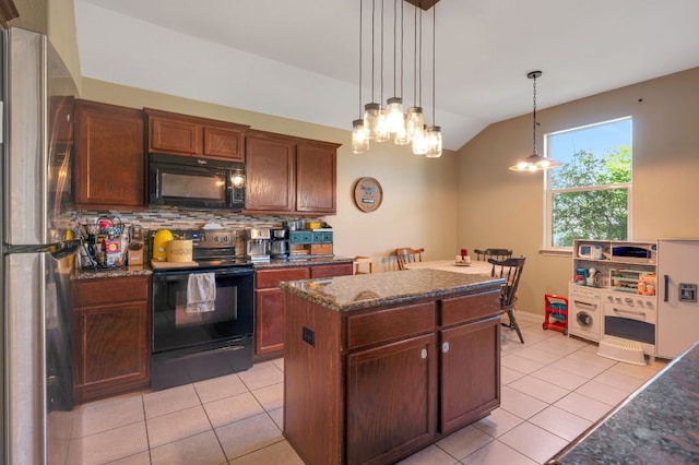 213 Sapphire Ln, Jarrell, TX 76537 - kitchen featuring black appliances, vaulted ceiling, light tile patterned floors, tasteful backsplash, and a kitchen island