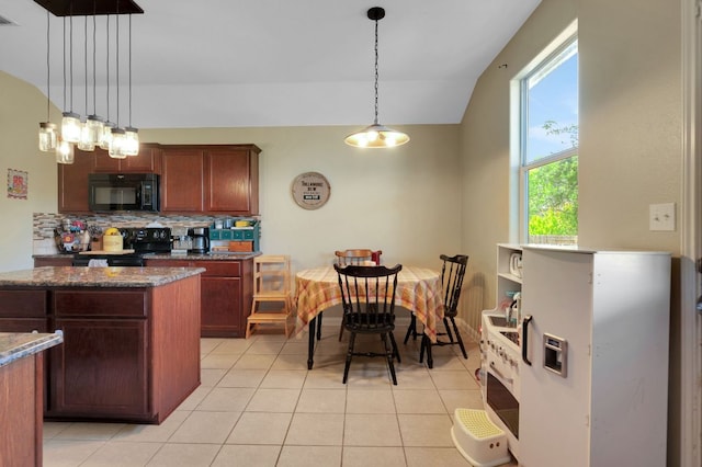 213 Sapphire Ln, Jarrell, TX 76537 - kitchen with black appliances, decorative backsplash, light tile patterned floors, hanging light fixtures, and lofted ceiling