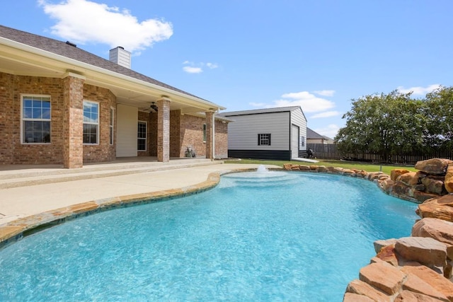 3585 W Amity Rd, Salado, TX 76571 - view of pool with fence, a patio, a ceiling fan, and an outbuilding