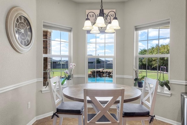 3585 W Amity Rd, Salado, TX 76571 - dining room with a chandelier, a textured wall, healthy amount of natural light, and baseboards