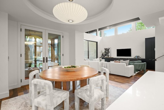 1705 Collier St, Austin, TX 78704 - dining area featuring french doors, wood finished floors, and a raised ceiling