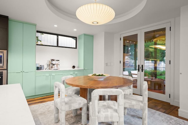 1705 Collier St, Austin, TX 78704 - dining area with wood finished floors, french doors, recessed lighting, and a raised ceiling