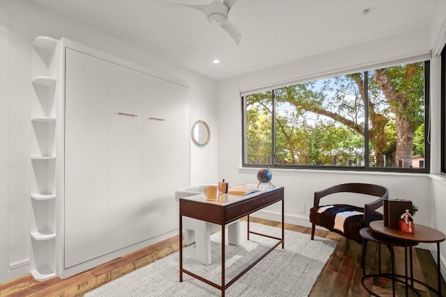 home office featuring plenty of natural light, wood finished floors, a ceiling fan, and recessed lighting