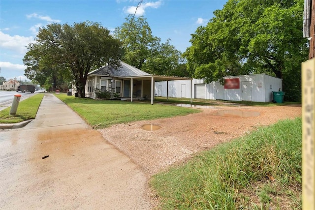 300 Bishop St, Smithville, TX 78957 - view of community featuring a yard and driveway