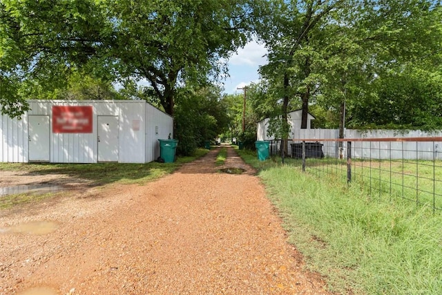 300 Bishop St, Smithville, TX 78957 - view of yard featuring fence and an outdoor structure