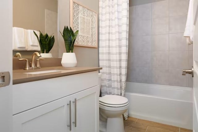 bathroom with toilet, vanity, and shower / bath combination with curtain