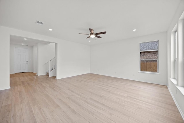 3740 Liberi Ln, Round Rock, TX 78655 - unfurnished room featuring light wood finished floors, stairs, ceiling fan, and recessed lighting