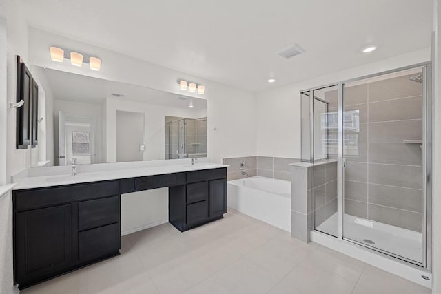 3740 Liberi Ln, Round Rock, TX 78655 - full bathroom featuring a bath, a stall shower, double vanity, tile patterned floors, and recessed lighting