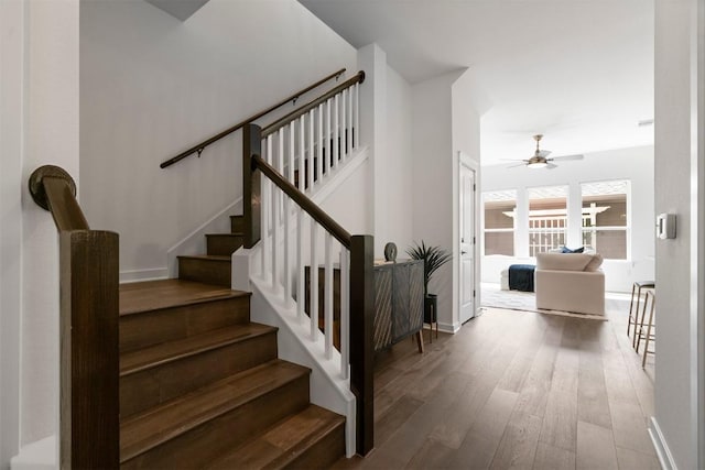 4108 Berkman Dr, Austin, TX 78723 - stairs featuring wood finished floors, a ceiling fan, and baseboards