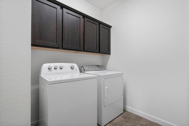 4108 Berkman Dr, Austin, TX 78723 - washroom featuring independent washer and dryer, cabinet space, baseboards, and tile patterned floors