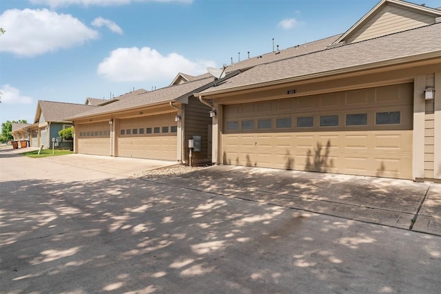 4108 Berkman Dr, Austin, TX 78723 - view of home's exterior featuring driveway and a shingled roof