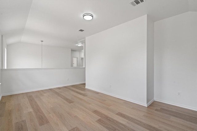 1816 Melissa Oaks Ln, Austin, TX 78744 - unfurnished room featuring lofted ceiling, wood finished floors, and baseboards