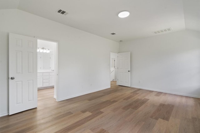 1816 Melissa Oaks Ln, Austin, TX 78744 - spare room with vaulted ceiling and light wood-type flooring