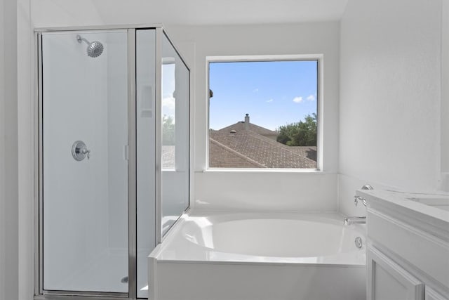 1816 Melissa Oaks Ln, Austin, TX 78744 - bathroom featuring a stall shower, a garden tub, and vanity