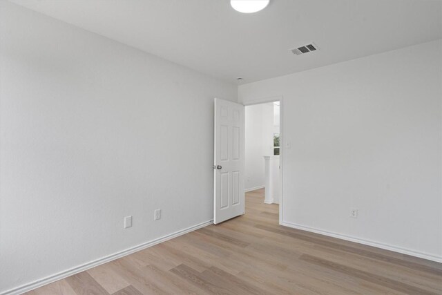 1816 Melissa Oaks Ln, Austin, TX 78744 - empty room featuring light wood-style flooring and baseboards