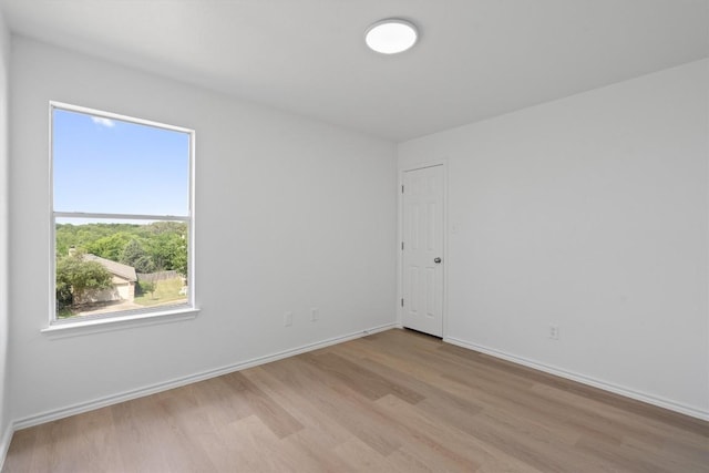 1816 Melissa Oaks Ln, Austin, TX 78744 - empty room with wood finished floors and baseboards