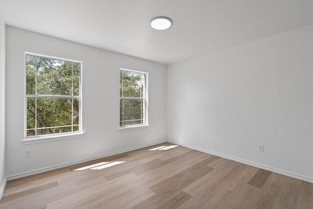 1816 Melissa Oaks Ln, Austin, TX 78744 - empty room featuring wood finished floors and baseboards