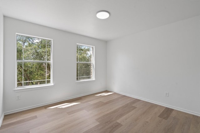 1816 Melissa Oaks Ln, Austin, TX 78744 - empty room featuring wood finished floors and baseboards