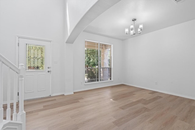 1816 Melissa Oaks Ln, Austin, TX 78744 - entryway with stairway, a chandelier, light wood-style floors, and baseboards