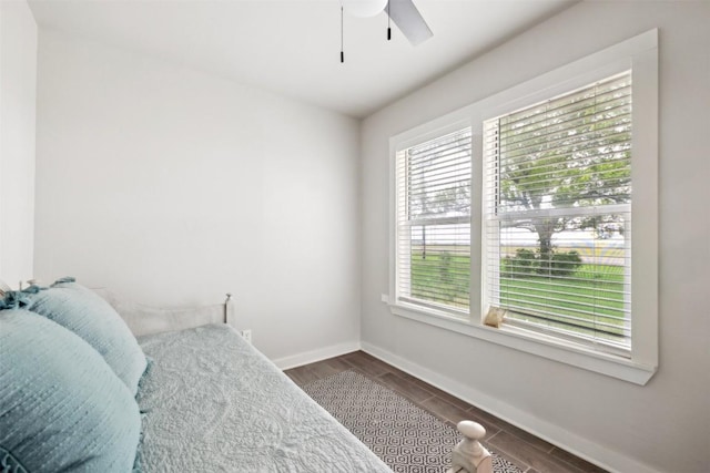 5530 US Highway 90a W, Shiner, TX 77984 - bedroom with baseboards, dark wood-style floors, and ceiling fan