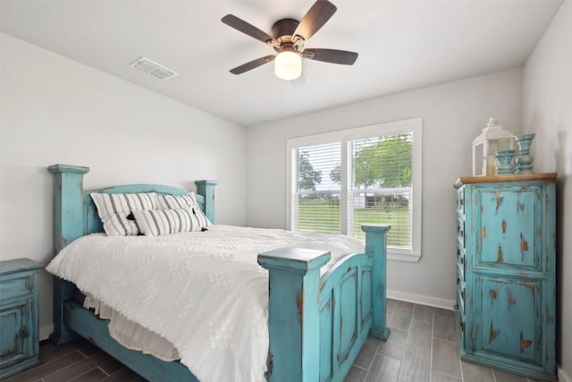 5530 US Highway 90a W, Shiner, TX 77984 - bedroom with wood tiled floors, baseboards, and ceiling fan