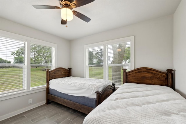 5530 US Highway 90a W, Shiner, TX 77984 - bedroom with baseboards, ceiling fan, and wood finished floors