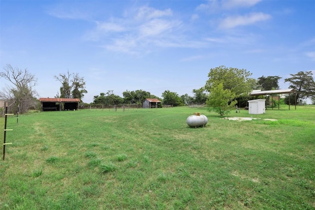 5530 US Highway 90a W, Shiner, TX 77984 - view of green lawn featuring an outbuilding and a storage shed