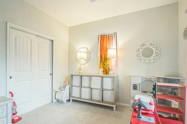 game room with carpet floors and baseboards