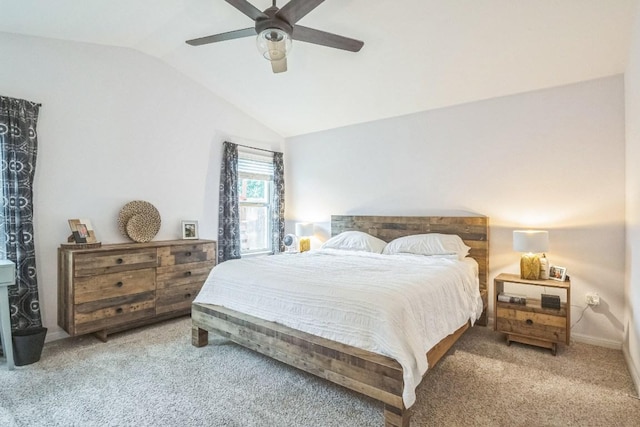 bedroom featuring vaulted ceiling, light colored carpet, ceiling fan, and baseboards
