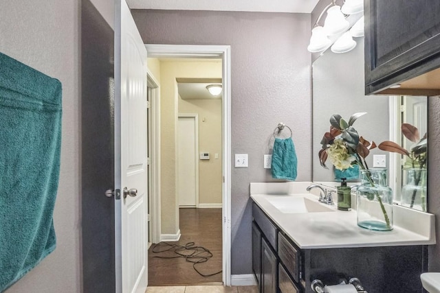 bathroom featuring vanity and baseboards