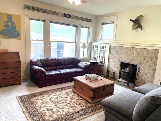 205 Sixth St, Mexia, TX 76686 - carpeted living room featuring a wood stove