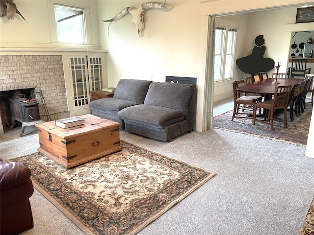 205 Sixth St, Mexia, TX 76686 - living area featuring a wood stove and carpet floors