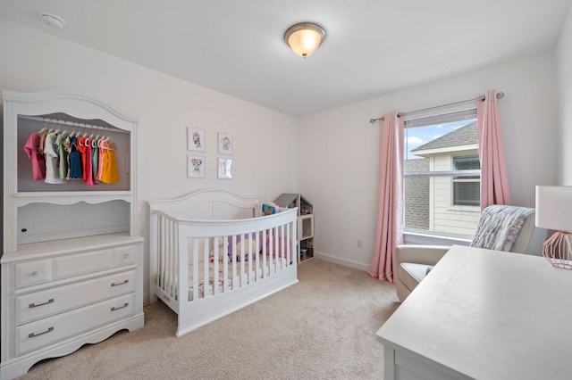 2324 Sawdust Dr, Georgetown, TX 78633 - bedroom with light colored carpet, a crib, and baseboards