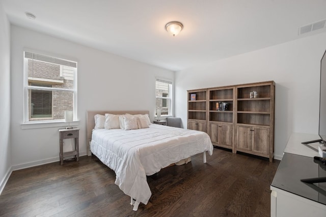 2324 Sawdust Dr, Georgetown, TX 78633 - bedroom with dark wood finished floors and baseboards