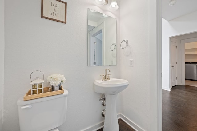 2324 Sawdust Dr, Georgetown, TX 78633 - half bath with toilet, wood finished floors, and baseboards