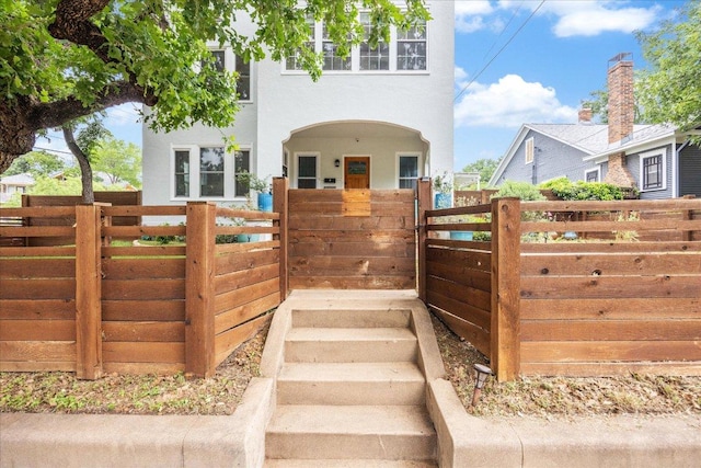 400 E 34th St, Austin, TX 78705 - view of front of property featuring stucco siding and a gate