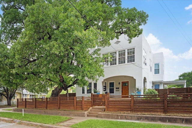 400 E 34th St, Austin, TX 78705 - view of front of house featuring stucco siding, a porch, and a fenced front yard