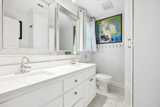 400 E 34th St, Austin, TX 78705 - full bathroom with double vanity, toilet, and baseboards