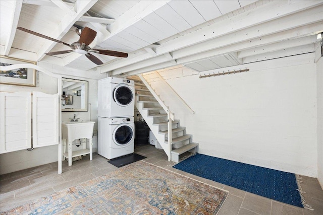 400 E 34th St, Austin, TX 78705 - laundry room featuring stacked washer / drying machine, a ceiling fan, and wooden ceiling