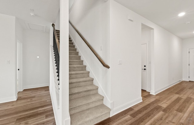 16804 Santiaguillo Trce, Manor, TX 78653 - staircase featuring wood finished floors, recessed lighting, and attic access