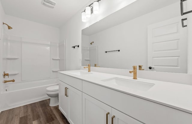 16804 Santiaguillo Trce, Manor, TX 78653 - full bath with double vanity, shower / tub combination, and wood finished floors