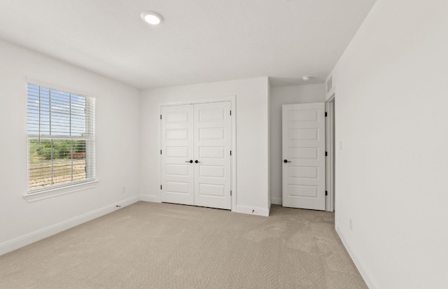 16804 Santiaguillo Trce, Manor, TX 78653 - unfurnished bedroom featuring light colored carpet and a closet
